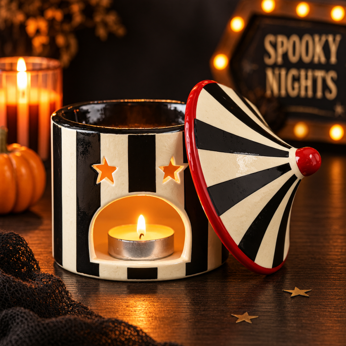 Cyrkowy kominek zapachowy z ceramiczną pokrywą, czerwonymi detalami i świeczką tealight w środku